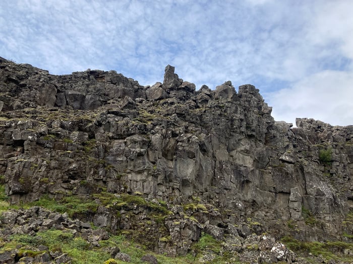 The towering presence of Almannagja. It forms one side of a rift valley within the Mid-Atlantic Ridge between North America and Eurasia. This was the spectacular back drop of the Althing Assembly.