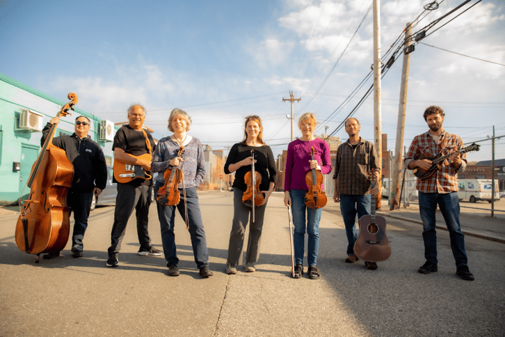 Fiddlers Three: Melissa Bragdon Caron, Ellen Carlson, and Kathy Sommer Zimpfer with Kris Day, Denny Breau, Rob Kneeland, and Steve Roy. (photo credit: Rebecca Conley)