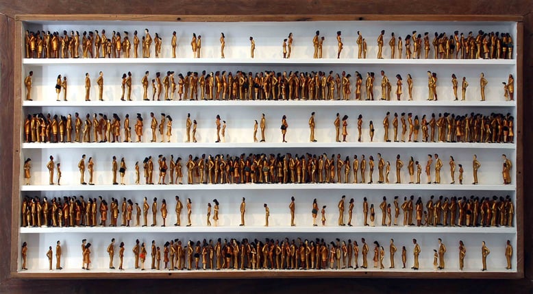 Gold Rush, plastic figurines in an antique garden table base, 75 x 136 cm. The figurines in this artwork appear to be manically searching for more money, more gold, more wealth. But can it still be found? 