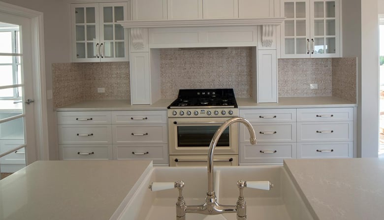French kitchen with glass door and marble benchtop