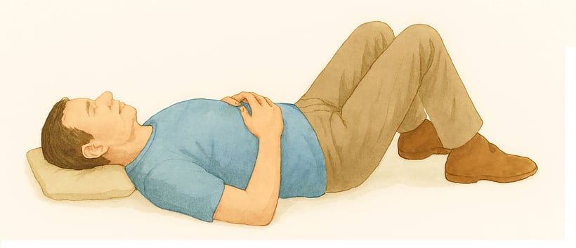 Man lying in Alexander Technique Semi-Supine position. Also known as Constructive Rest