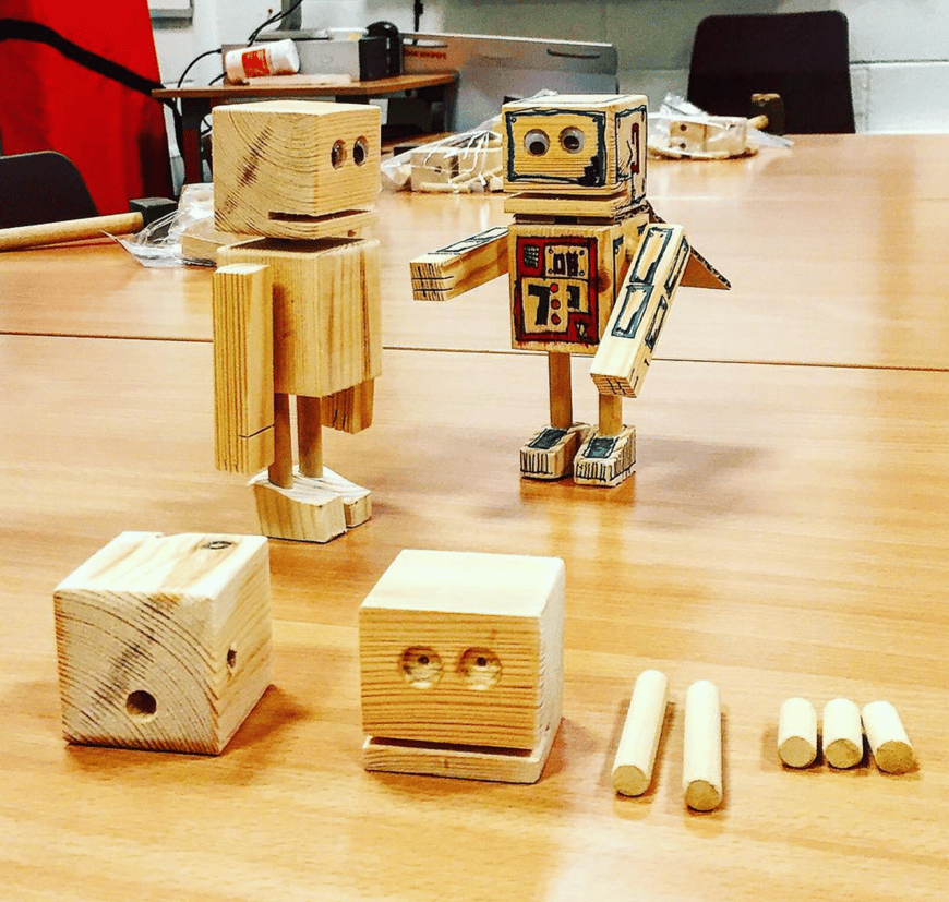 Picture of two robots and a set of parts to make robot