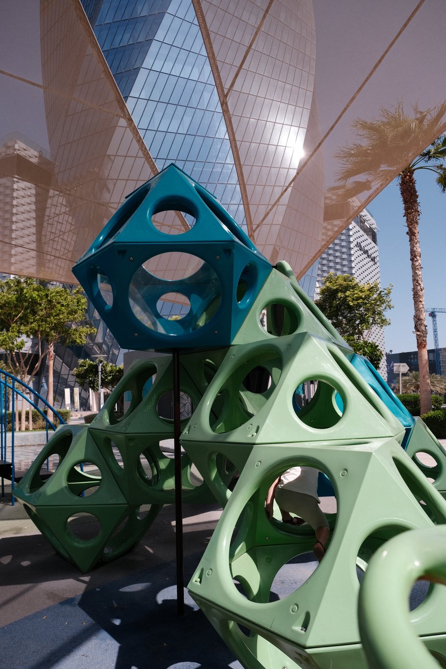 Shaded Playground at Bahrain Bay with its skyline in the background 