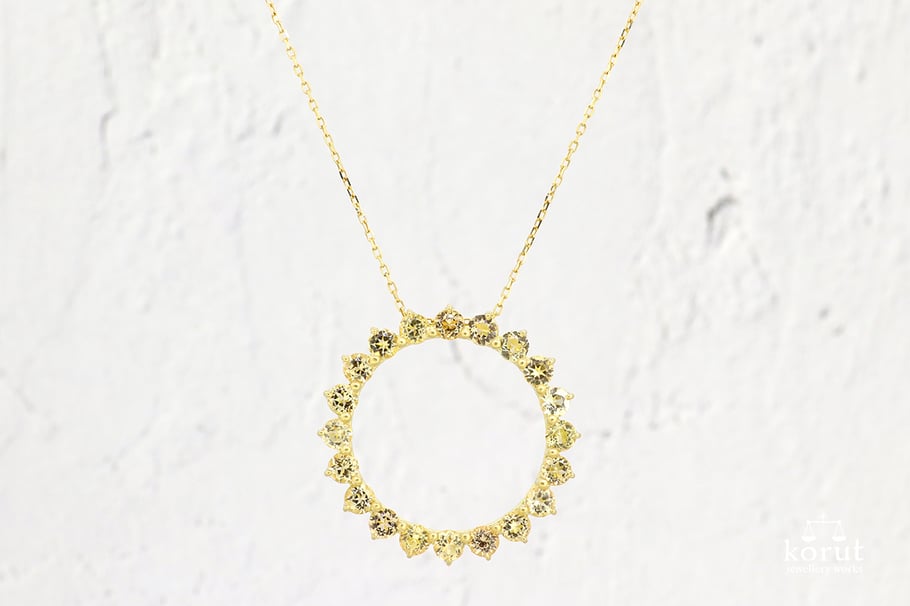 サークル状のペンダントトップ、K18インペリアルトパーズ