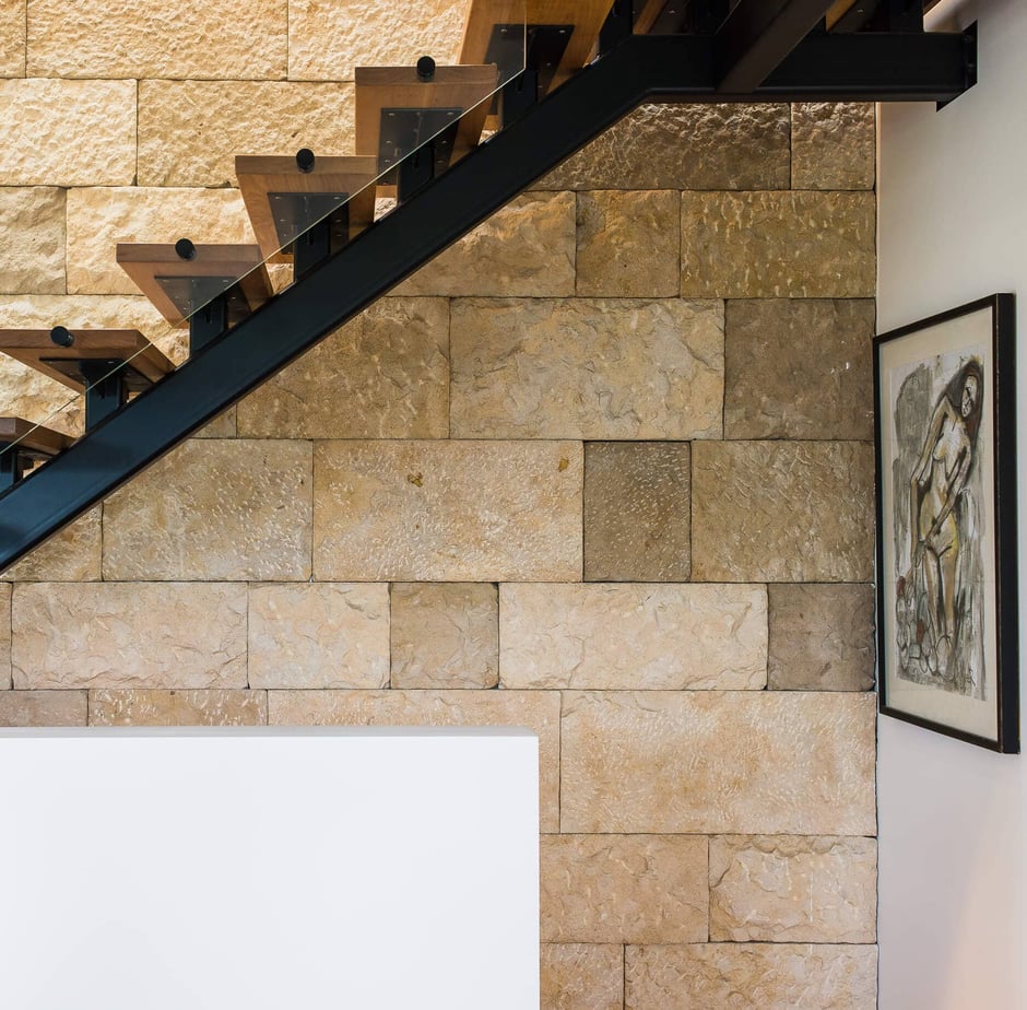 Architectural staircase and interior stonework in a Newcastle residential design project by Flourish.