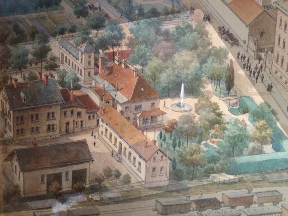 1910 Villa Christian - Ausschnitt vom Firmengemälde (durch das Fabriktor (rechter oben) verläuft heute die Marienstrasse)